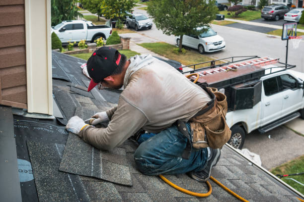 Professional Roof Replacement technician working in Plainville, MA